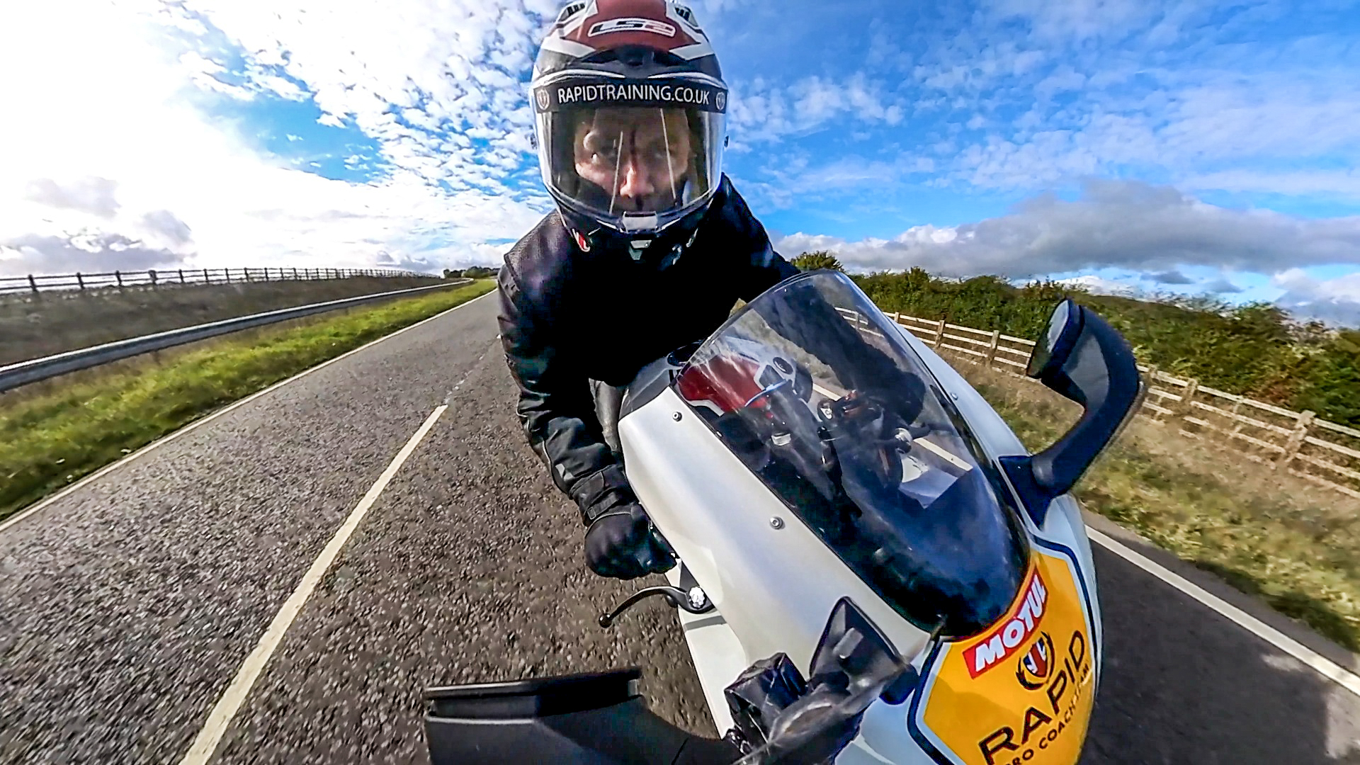 A close up view of a motorcyclist driving.